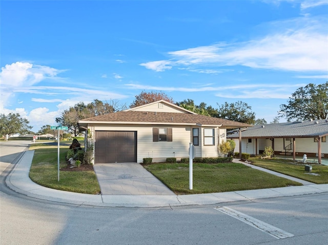 single story home featuring a garage and a front lawn