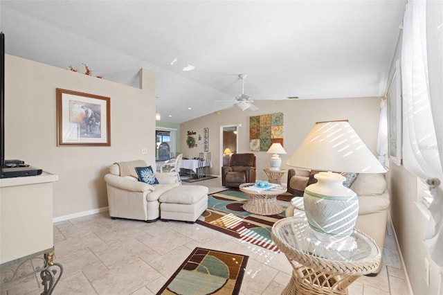 living room featuring ceiling fan and lofted ceiling