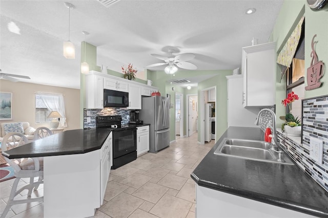 kitchen with pendant lighting, black appliances, decorative backsplash, sink, and white cabinetry