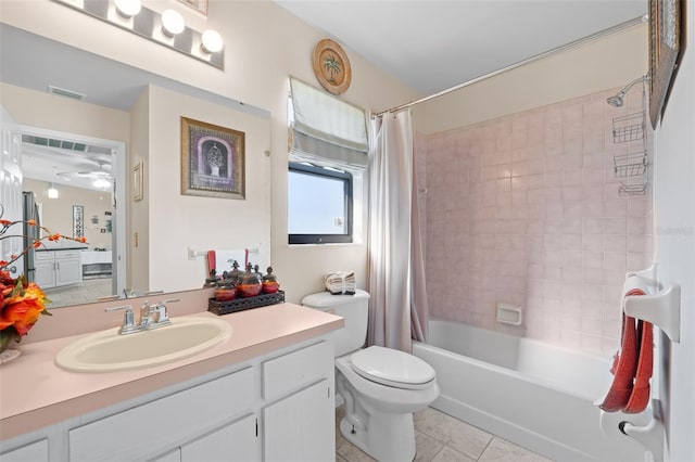 full bathroom with toilet, tile patterned flooring, vanity, and shower / bath combo with shower curtain