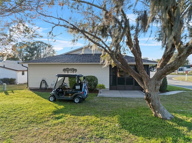 view of home's exterior with a lawn and a patio