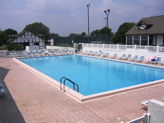 view of swimming pool with a patio