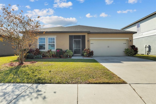 view of front of property with a garage and a front lawn