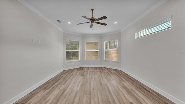 unfurnished room with ornamental molding, ceiling fan, and light wood-type flooring