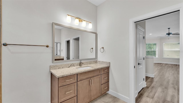 bathroom with vanity, wood-type flooring, and ceiling fan