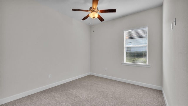 unfurnished room featuring ceiling fan and carpet flooring