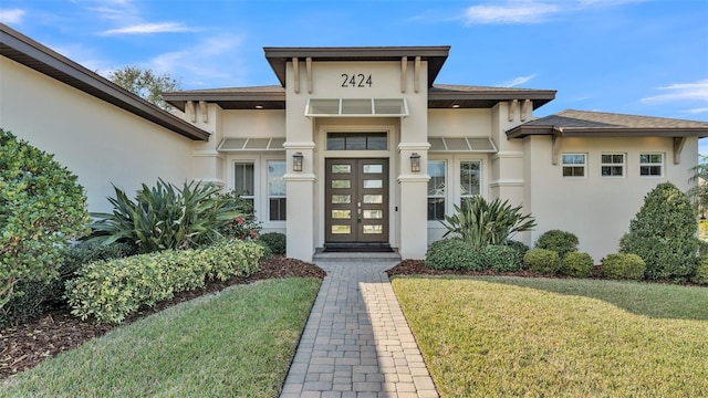 property entrance with french doors and a yard