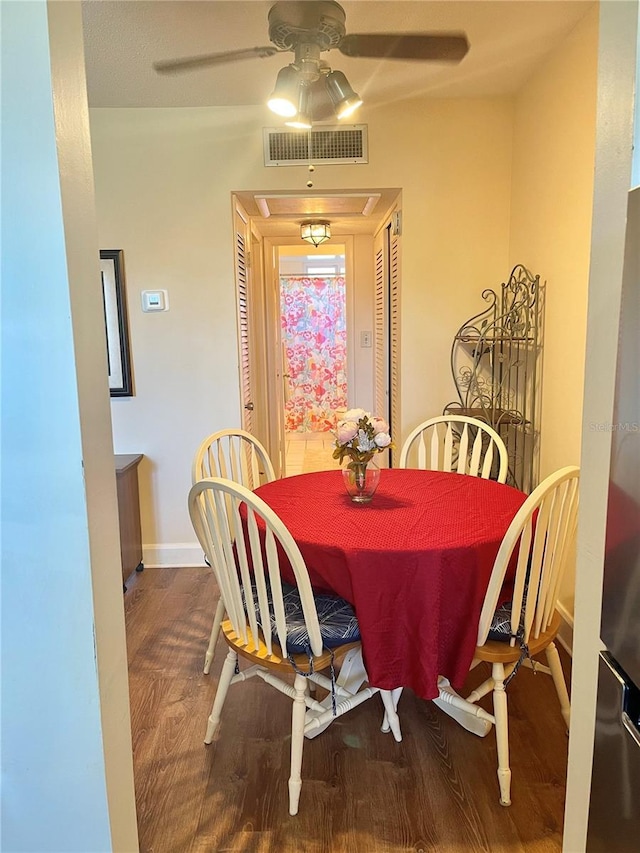 dining room with ceiling fan and wood-type flooring