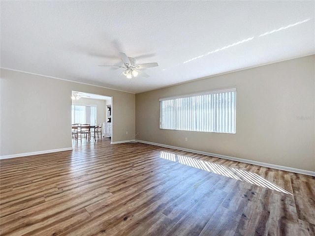 spare room featuring ceiling fan, a textured ceiling, and hardwood / wood-style floors