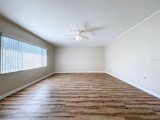 spare room with ceiling fan and hardwood / wood-style floors