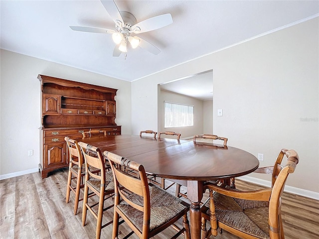 dining area featuring ceiling fan and light hardwood / wood-style flooring