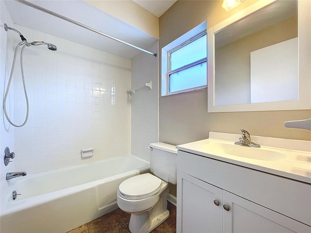 full bathroom with toilet, vanity, tile patterned flooring, and tiled shower / bath