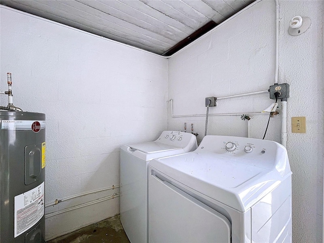 laundry room with electric water heater and washing machine and clothes dryer