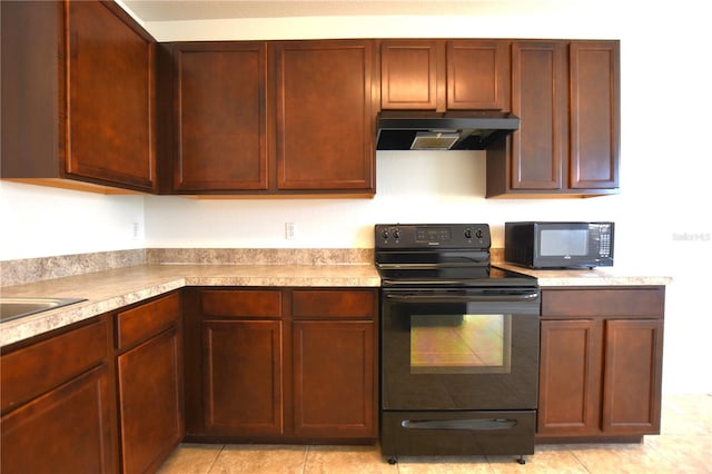 kitchen featuring black appliances and light tile patterned floors