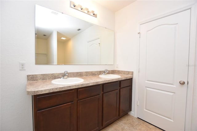 bathroom with vanity and tile patterned flooring