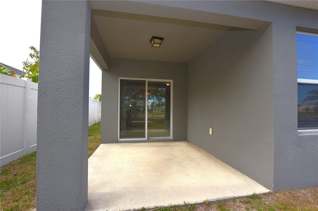 property entrance featuring a patio area