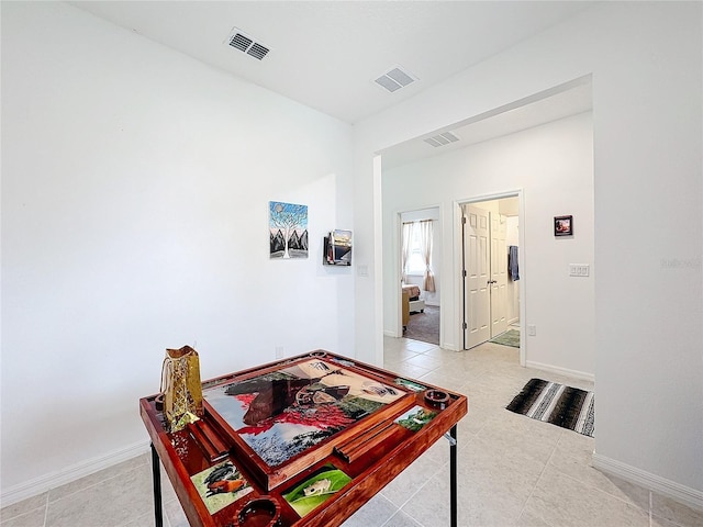 interior space with light tile patterned floors