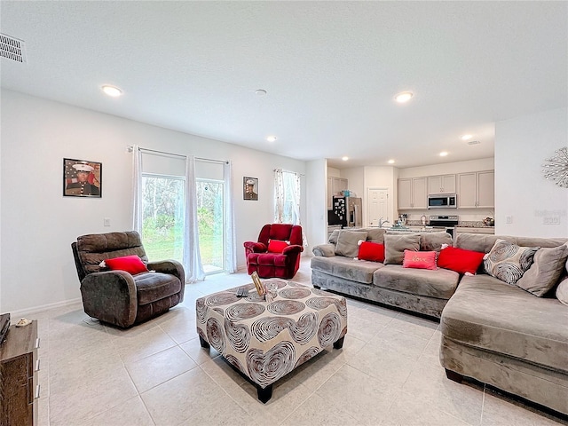 tiled living room with a textured ceiling