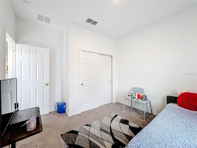 carpeted bedroom featuring a closet