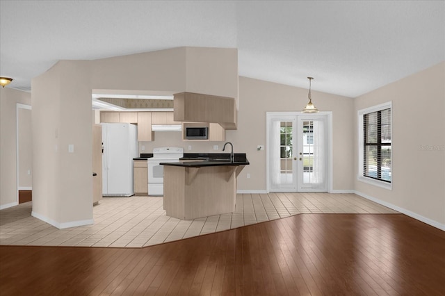 kitchen featuring stainless steel microwave, light hardwood / wood-style floors, pendant lighting, electric range, and french doors