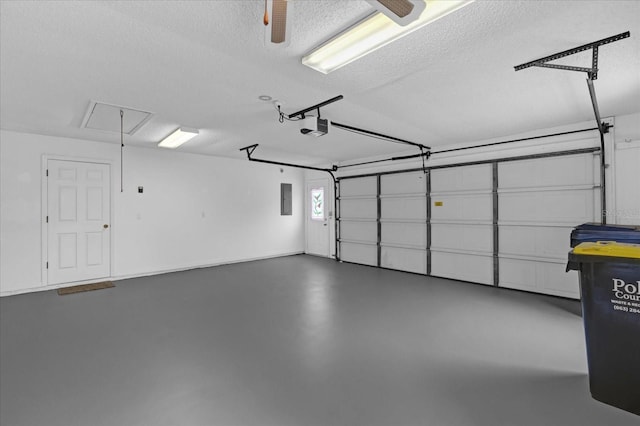 garage featuring electric panel and a garage door opener