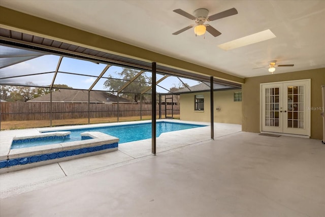 view of pool featuring a lanai, ceiling fan, french doors, an in ground hot tub, and a patio