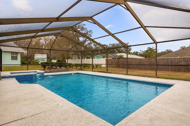 view of pool featuring a lanai, a patio area, and an in ground hot tub