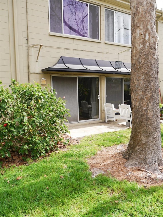 rear view of property featuring a patio