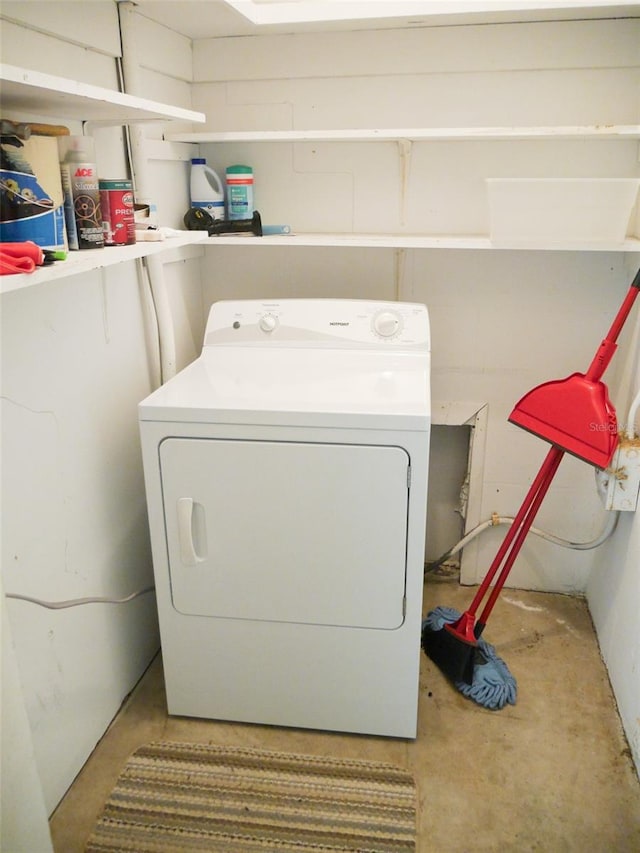 clothes washing area featuring washer / dryer and laundry area