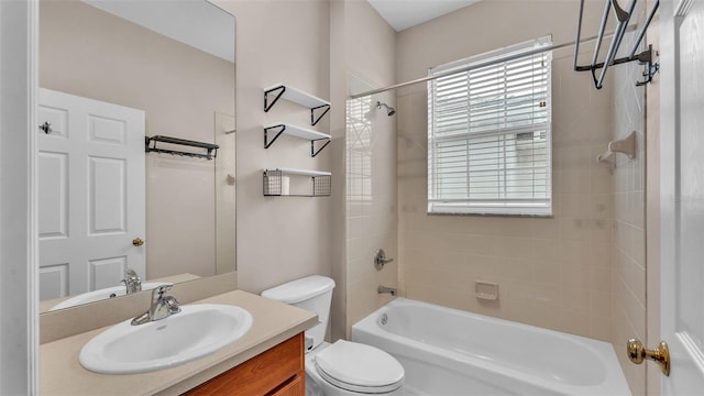 full bathroom featuring vanity, toilet, and tiled shower / bath