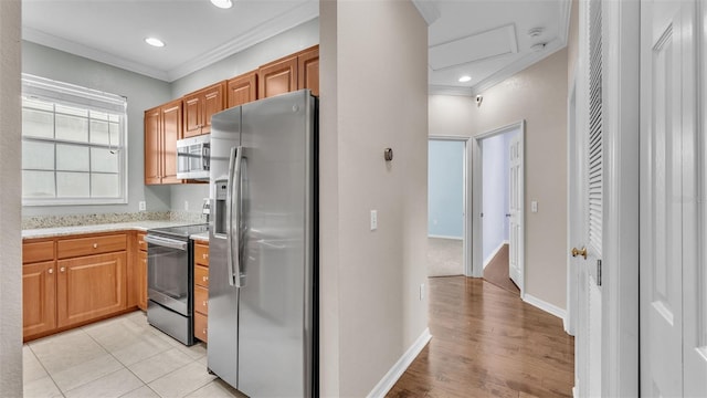 kitchen with stainless steel appliances and crown molding