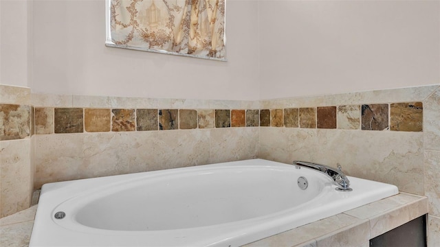 bathroom with tiled bath