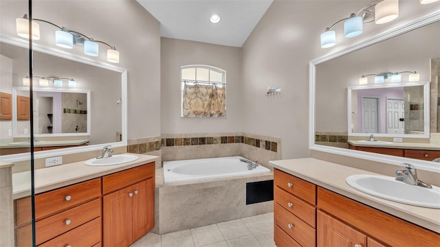 bathroom with vanity, shower with separate bathtub, and tile patterned floors