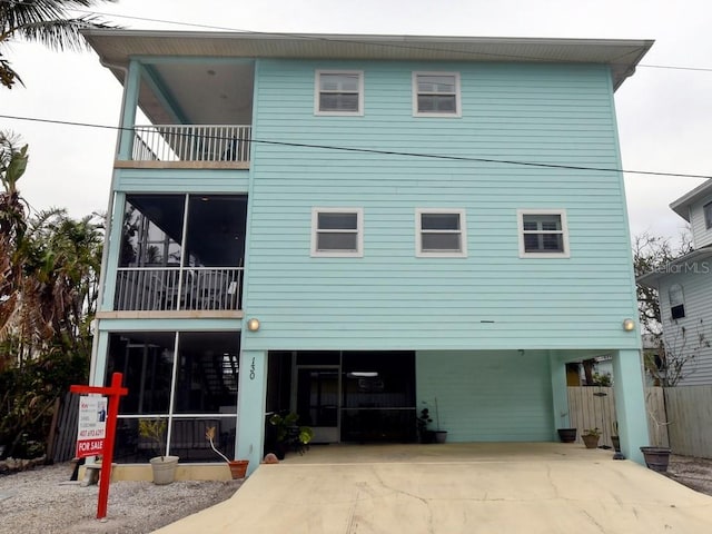 rear view of house with a carport