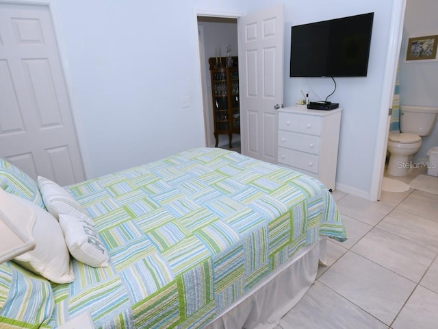 tiled bedroom with connected bathroom