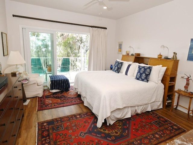 bedroom featuring access to outside, ceiling fan, and hardwood / wood-style floors