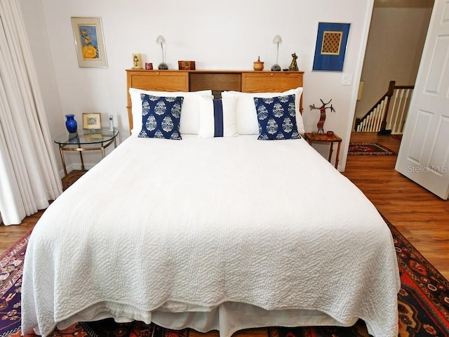 bedroom featuring wood-type flooring