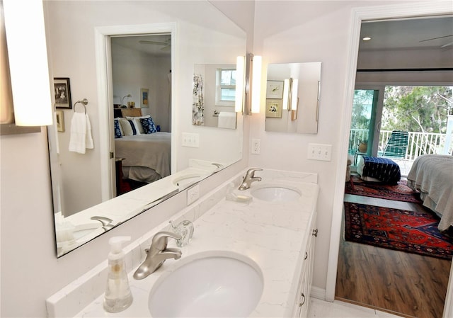 bathroom featuring lofted ceiling and vanity