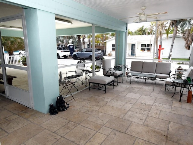 view of patio featuring an outdoor hangout area and ceiling fan