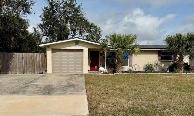 single story home featuring a front lawn and a garage