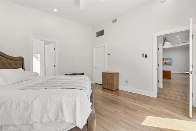 bedroom featuring ceiling fan and light hardwood / wood-style flooring