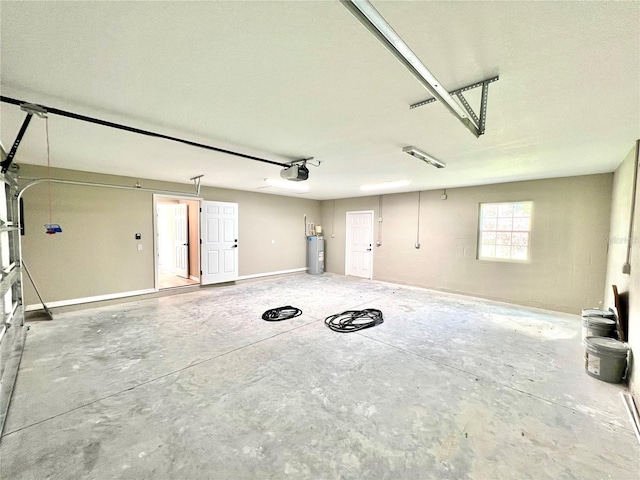 garage with water heater and a garage door opener