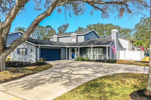 view of front of property featuring a front lawn and a garage