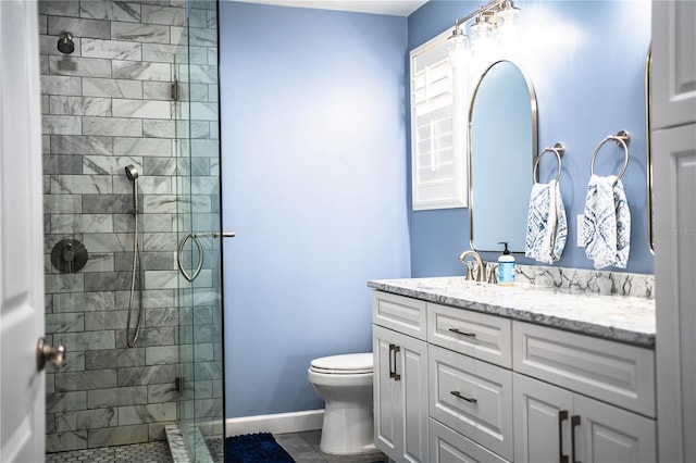 bathroom with a shower with door, tile patterned floors, toilet, and vanity