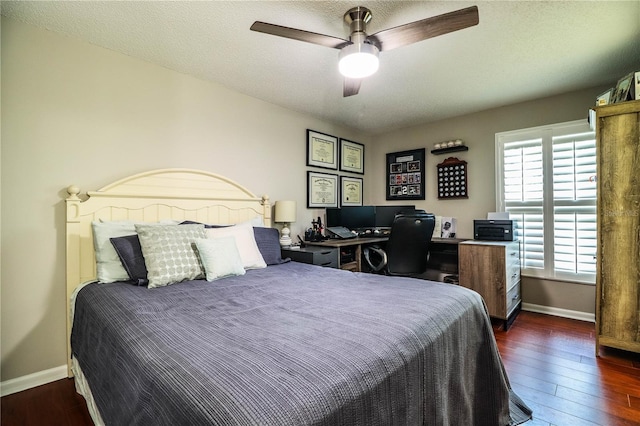 bedroom with a textured ceiling, ceiling fan, and dark hardwood / wood-style floors