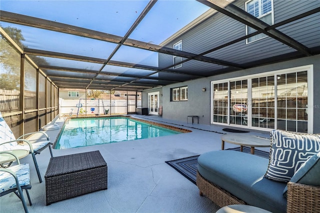 view of pool with a lanai and a patio