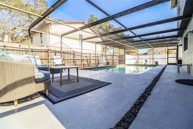 view of swimming pool featuring a patio area, a lanai, and outdoor lounge area