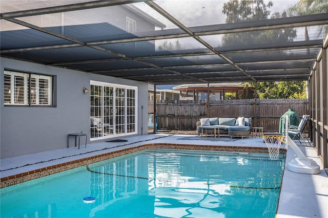 view of swimming pool featuring a lanai, an outdoor hangout area, and a patio