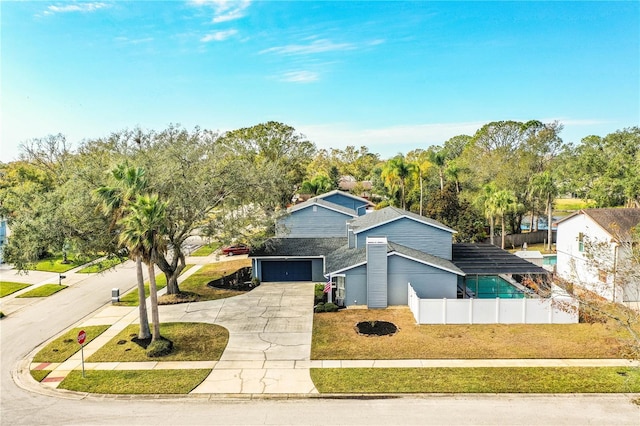 view of front facade featuring a front lawn and a garage