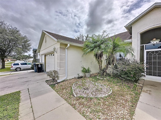 view of side of home with a garage